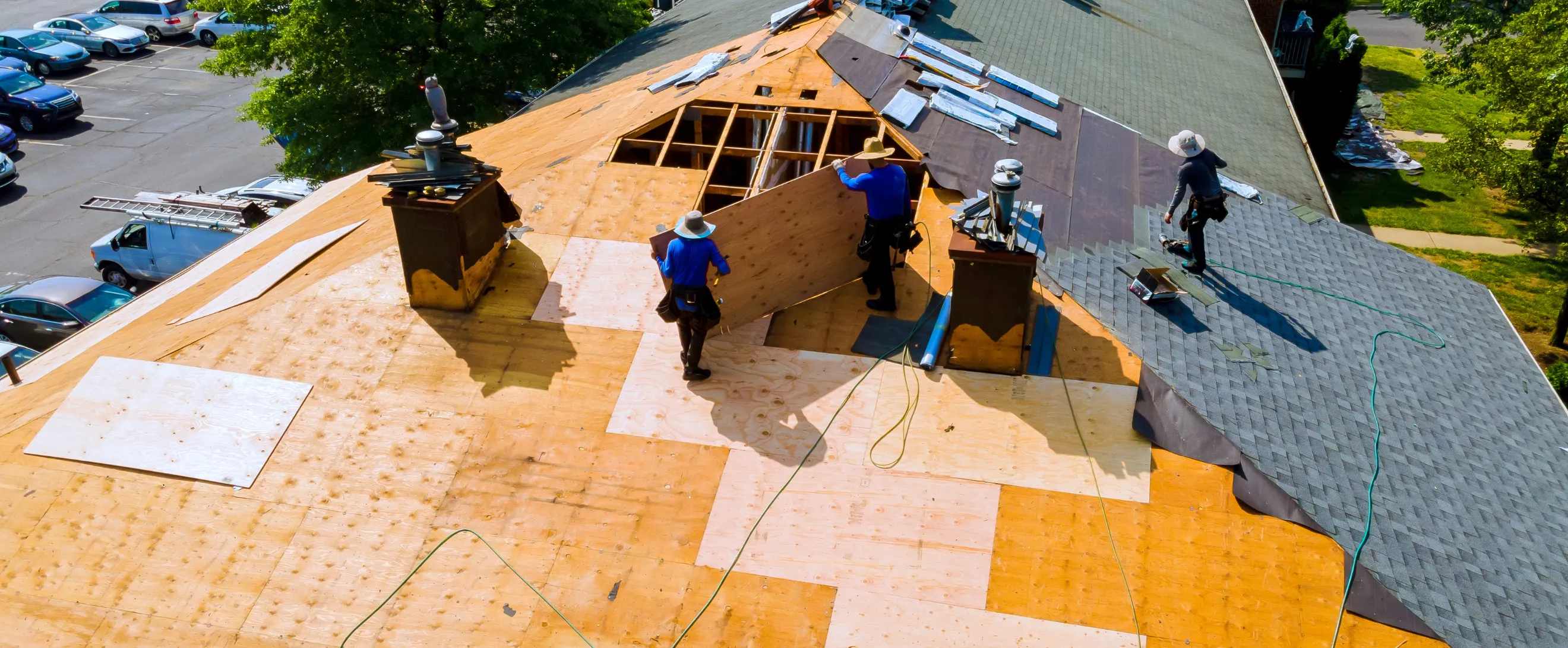 Damaged roof before roofing project in Los Angeles with exposed structure and old shingles