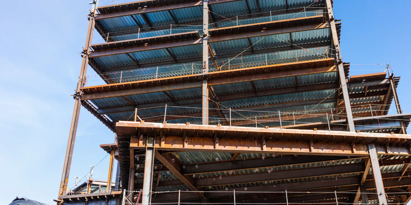 Commercial construction in Los Angeles with steel frame building structure and multi-story development in progress
