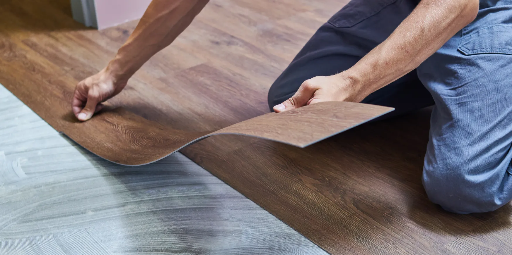 Flooring installation in Los Angeles with vinyl wood plank flooring being installed in modern residential space