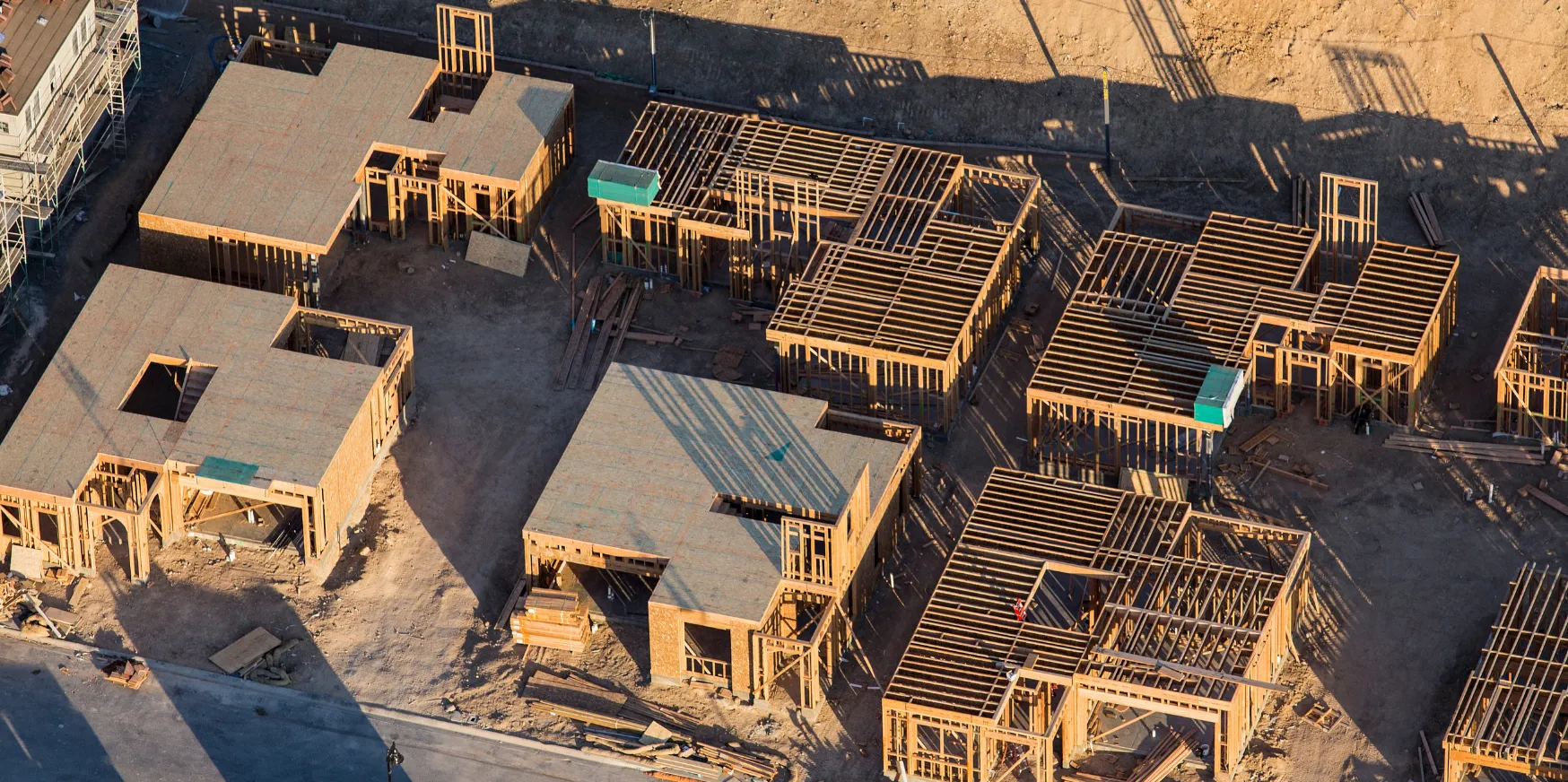 New construction custom homes in Los Angeles with wood framing structure and residential development in progress